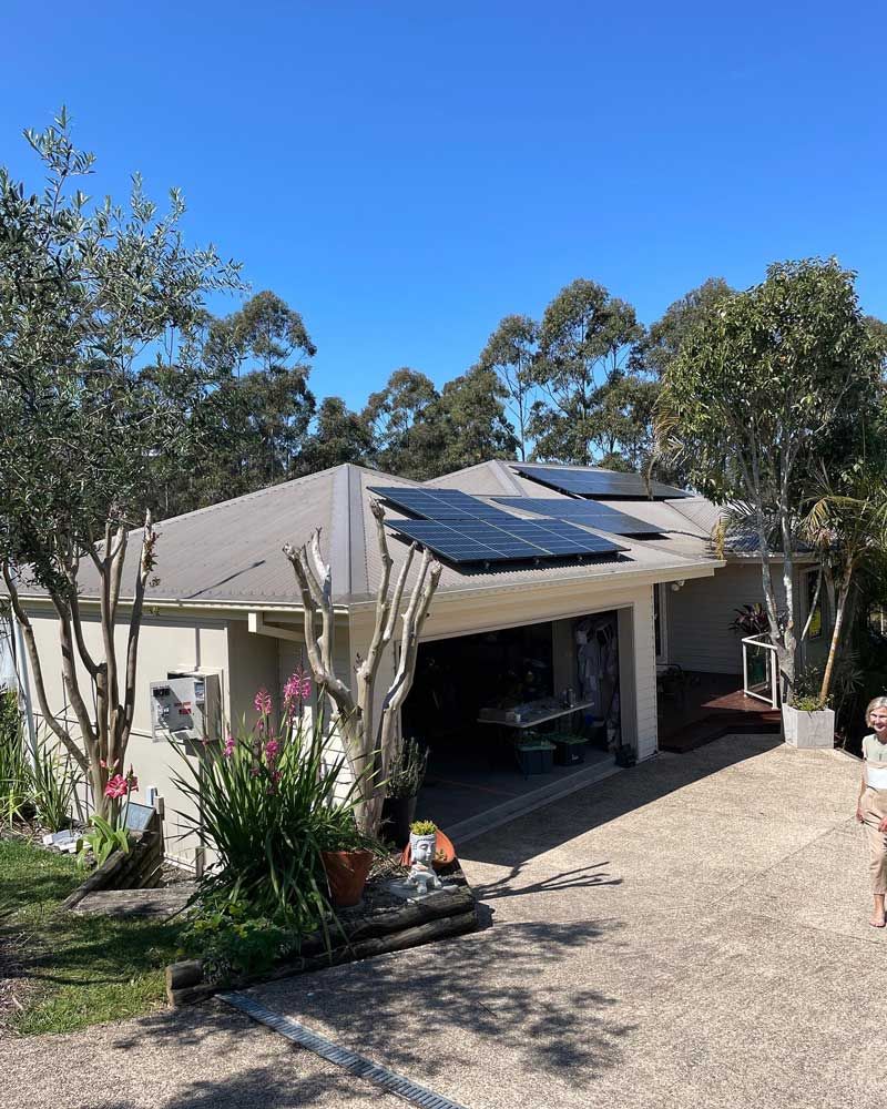A House With a Garage and Solar Panels on the Roof — Ocean Air Electrical in Skennars Head, NSW