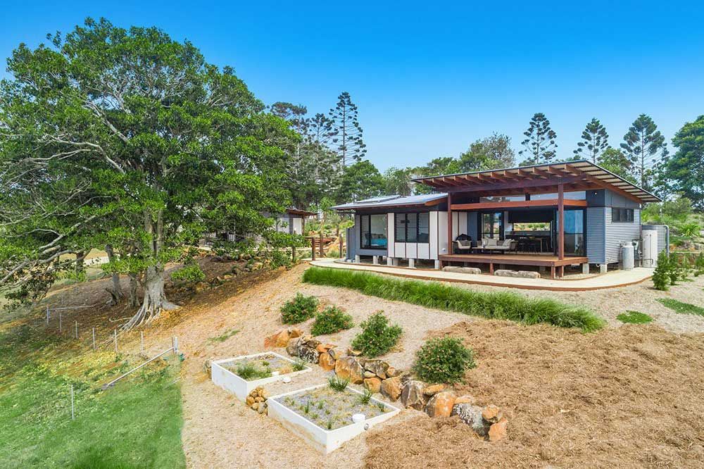 A House in the Middle of a Field After Electrical Servicing Has Been Done — Ocean Air Electrical in Skennars Head, NSW