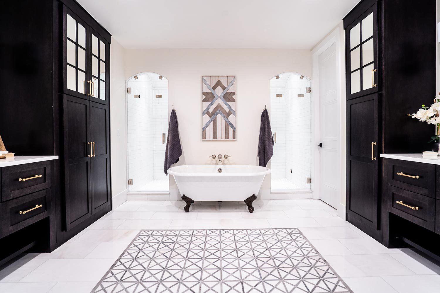 There is a bathtub in the middle of the bathroom.