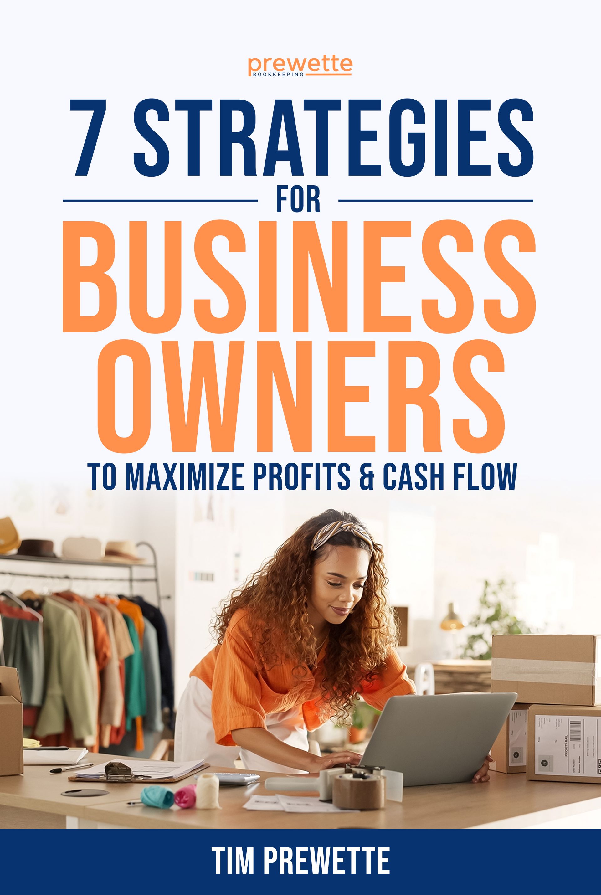 A woman is sitting at a table using a laptop computer.