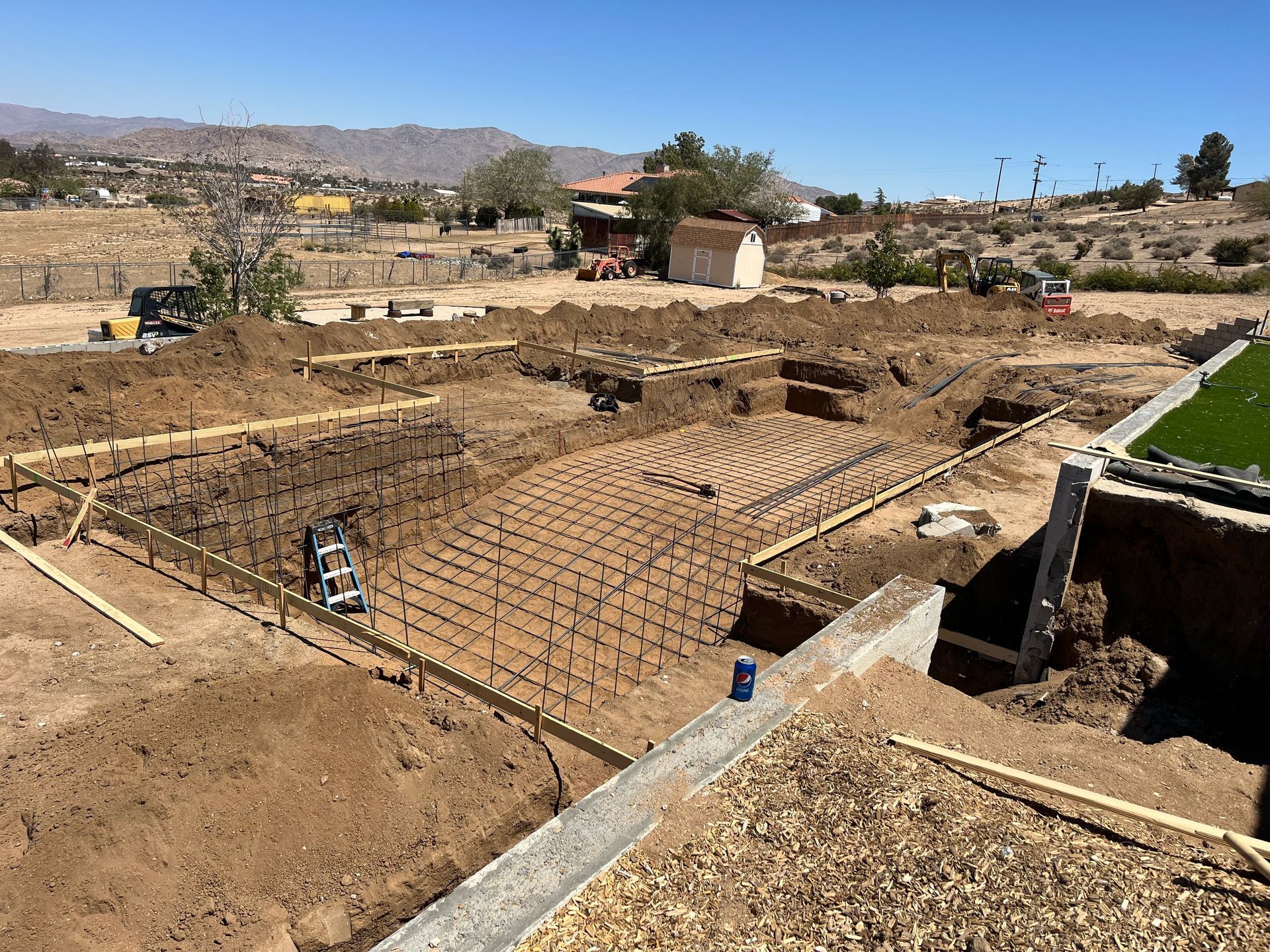 A construction site with a lot of dirt and concrete.