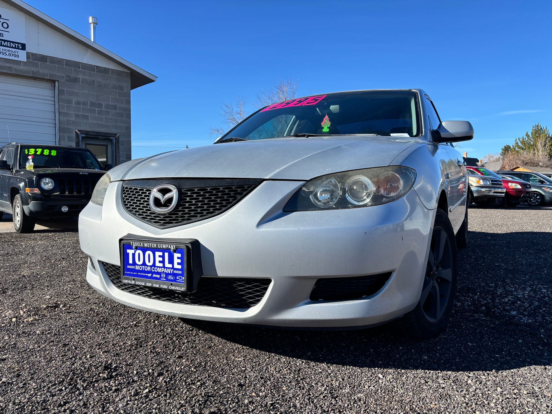 2006 Mazda3, reliable, great on gas.