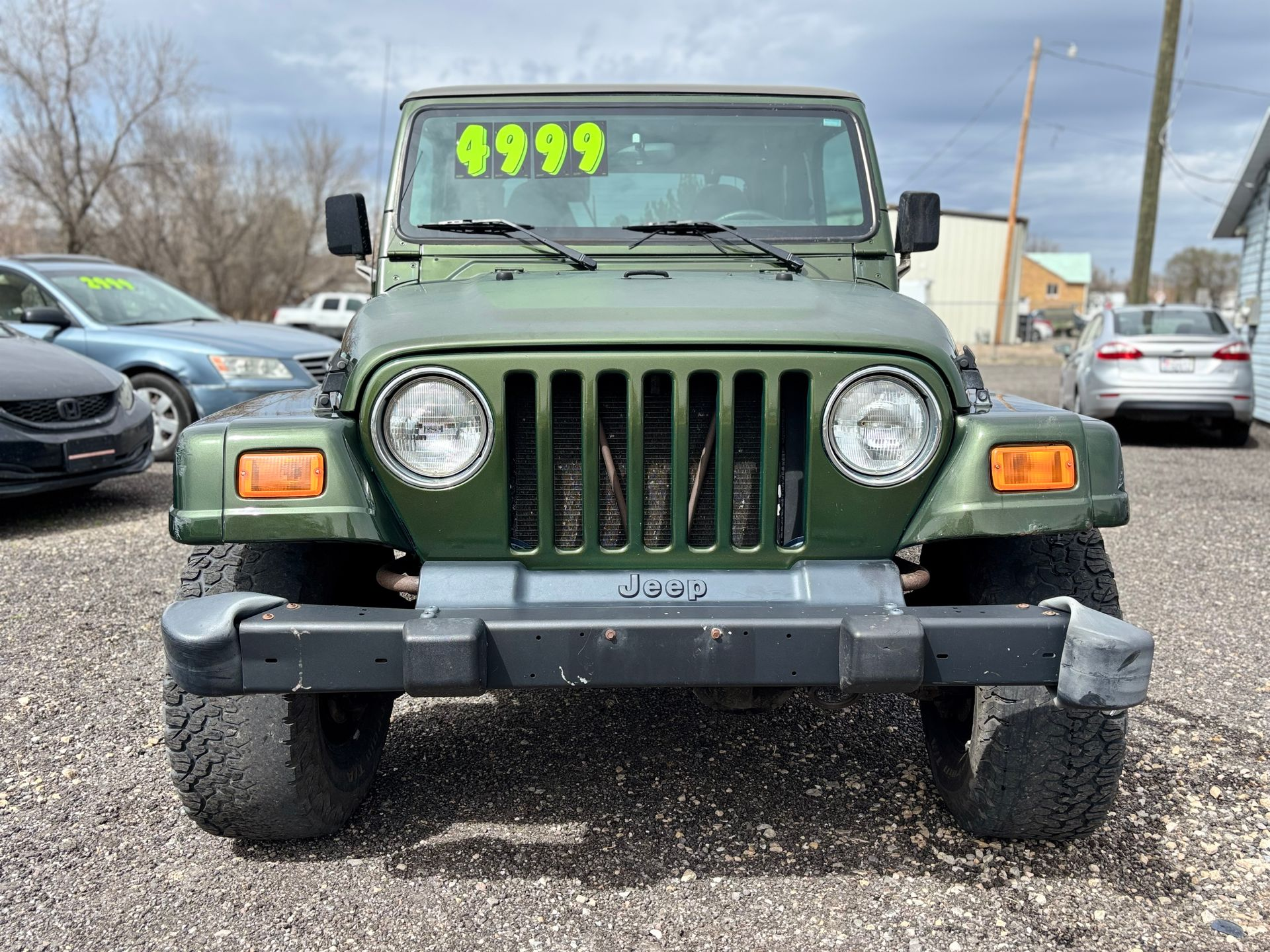 2002 Jeep Wrangler, custom tires, tow package, 4x4.
