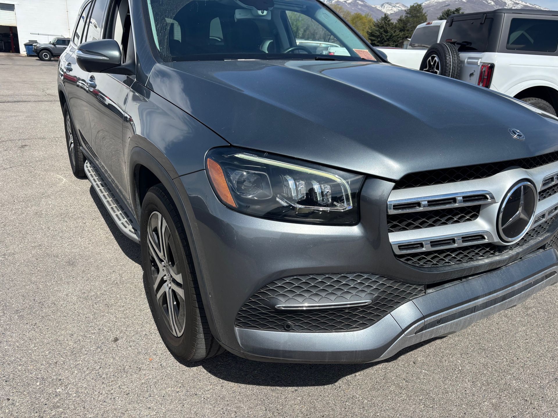 A mercedes benz gls class is parked in a parking lot.
