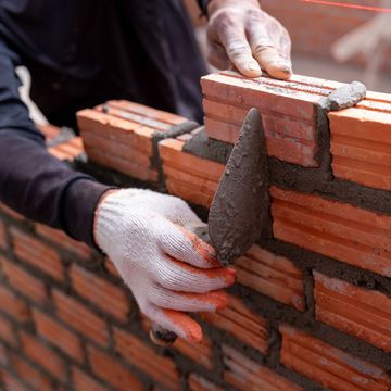 Worker Installing Bricks | Hudson Valley NY | Ms Ok Chimney Service