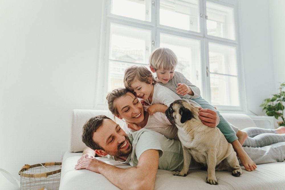 Cheerful Family With A Dog — Aurora, CO — Katherine Moskal Health Plans