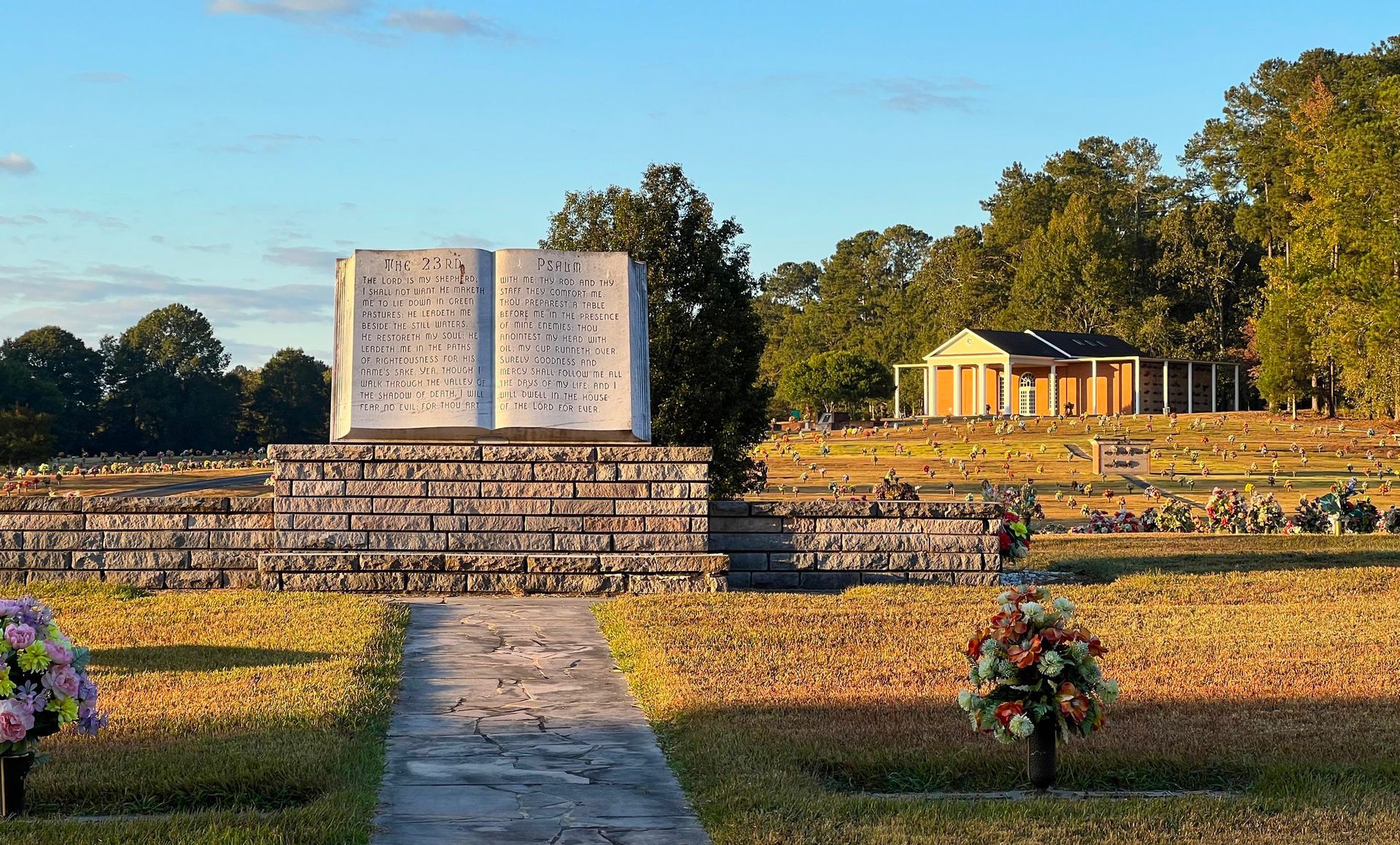 A cemetery with flowers and a book in the background