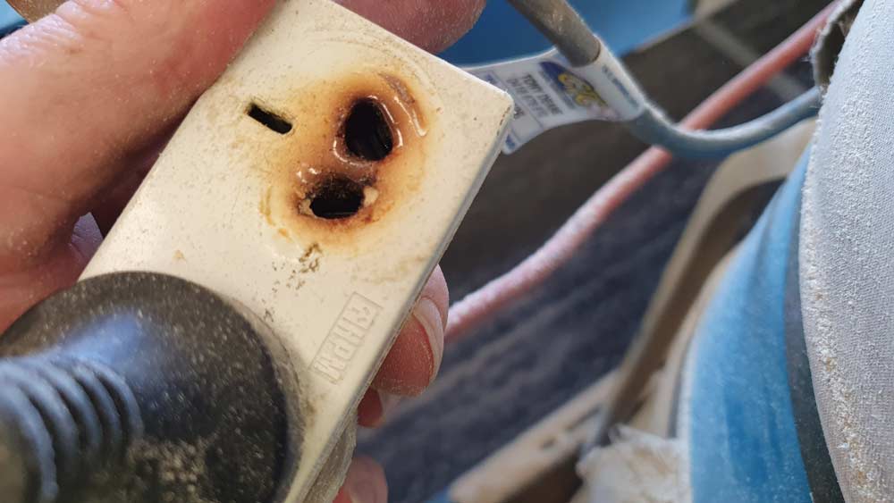 Damaged Power Socket With Burn Marks — Coastal Test & Tag in Bonville, NSW