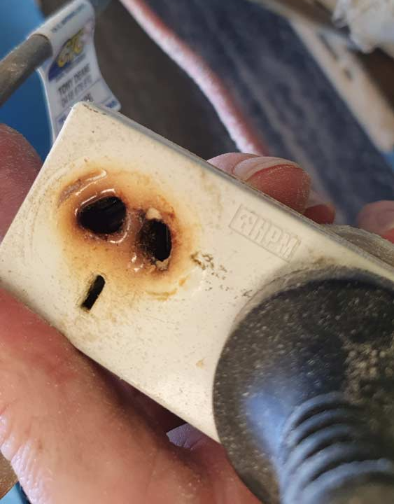 Man Holding Burned Electric Socket — Coastal Test & Tag in Bonville, NSW