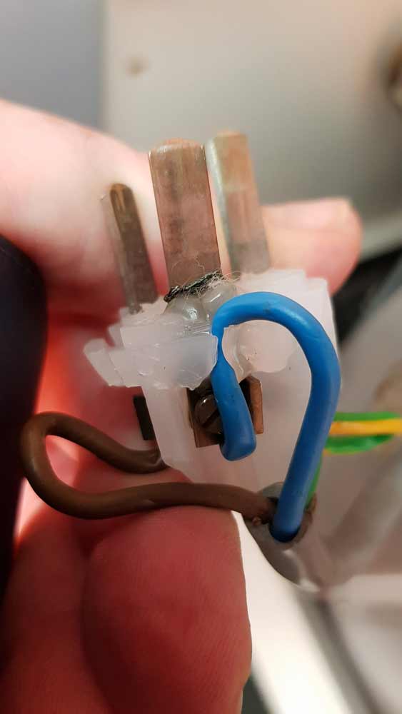 Man Holding Broken Power Plug — Coastal Test & Tag in Bonville, NSW