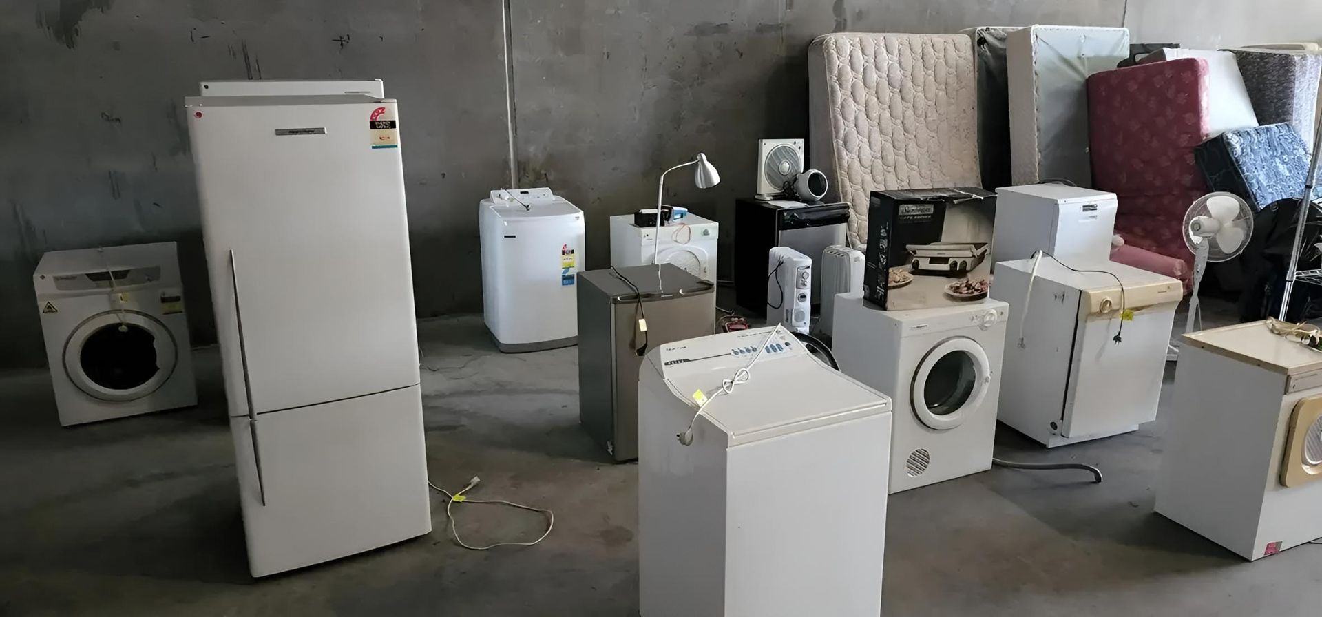 A Bunch of White Appliances Are Sitting in a Room — Coastal Test & Tag in Port Macquarie, NSW