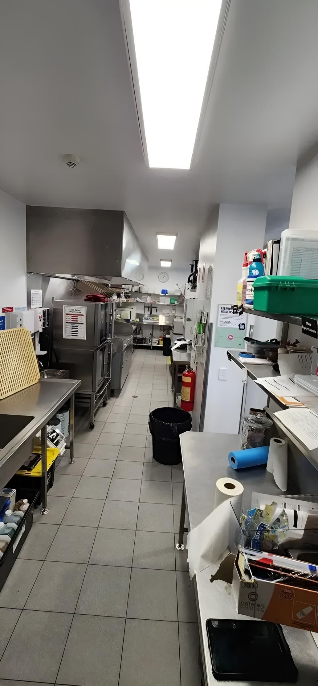 A Long Kitchen With a Lot of Appliances and a Sink — Coastal Test & Tag in Bonville, NSW