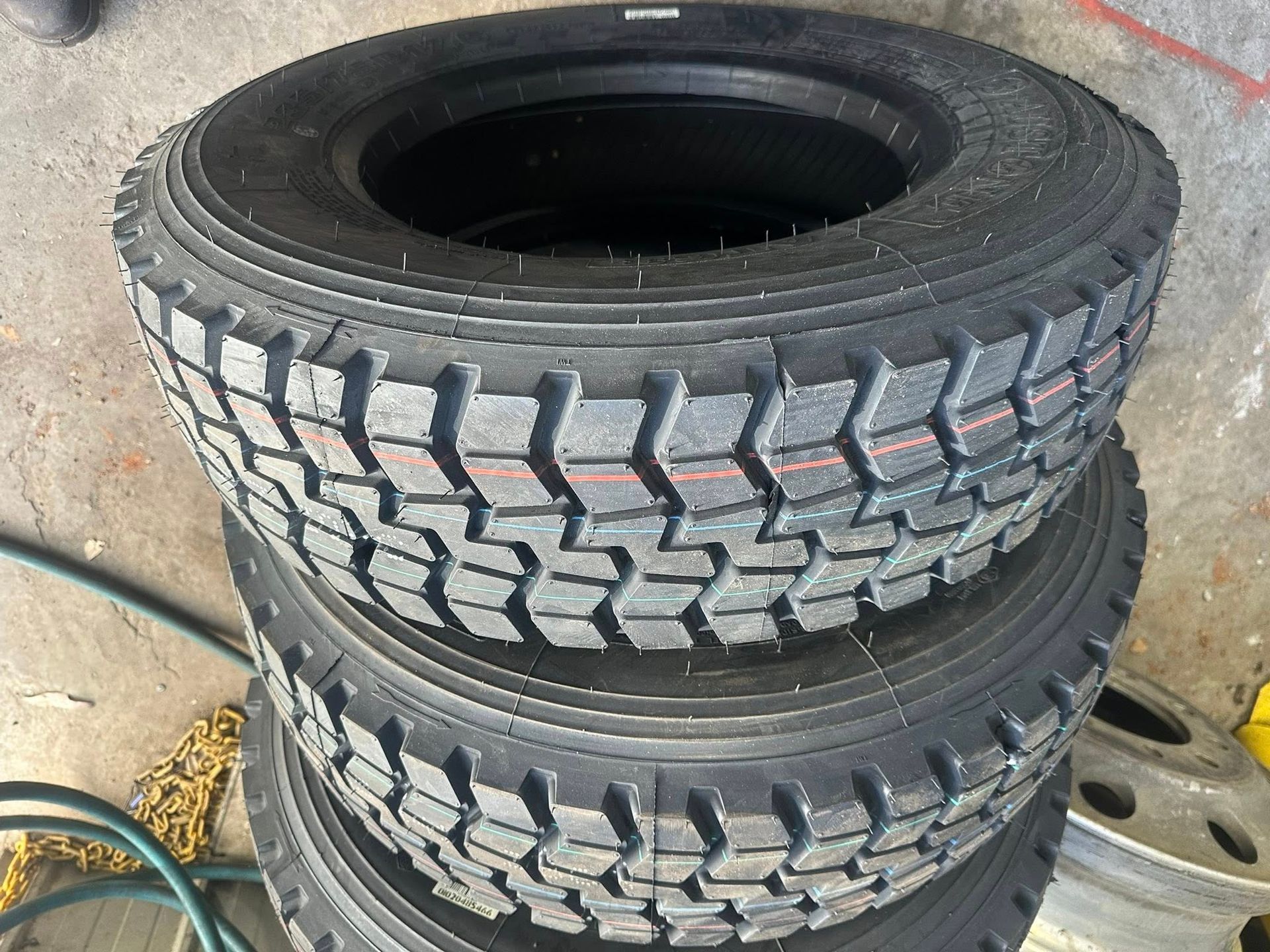 A Stack of Three Black, Heavy-duty Truck Tires — Mid North Coast Heavy Vehicle Repairs In Wauchope, NSW