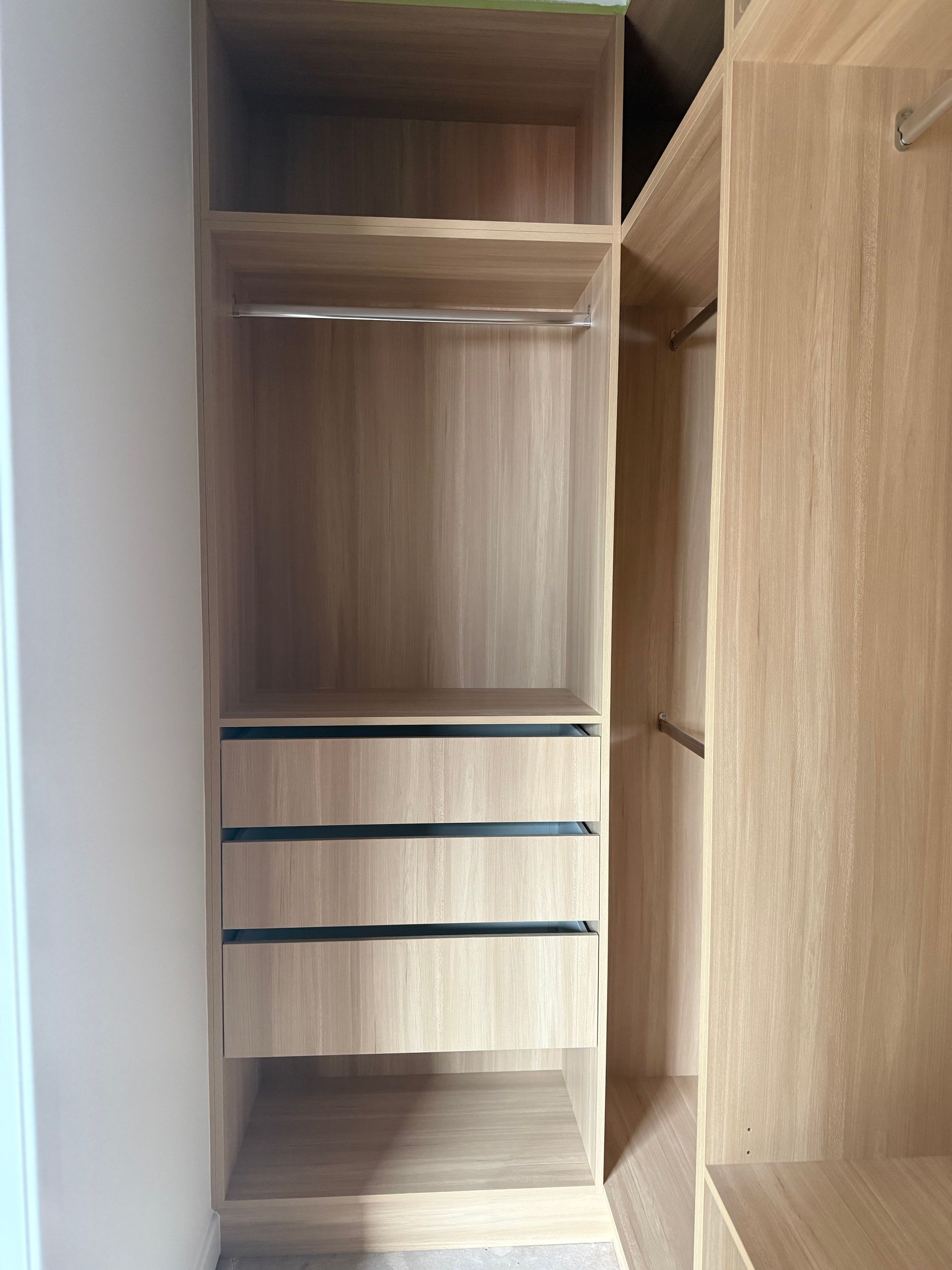 Wooden built-in closet with shelves, drawers, and hanging rods. Light wood colour  — Canelo Cabinetry In Rocklea, QLD