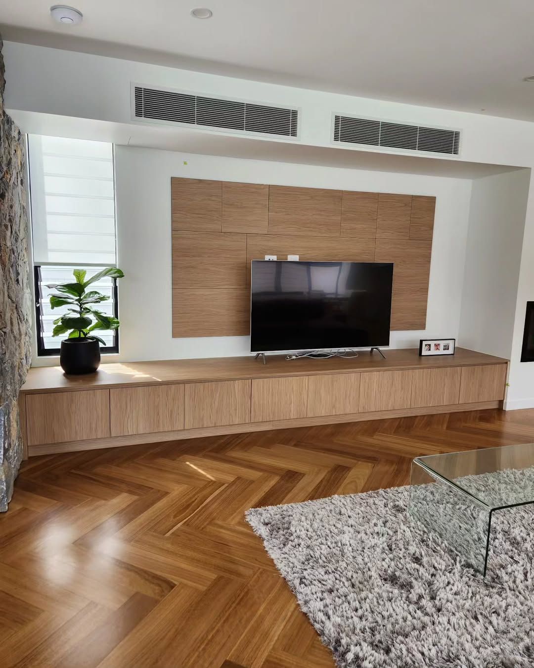 Living Room With Wooden Built-in Entertainment Center, TV, and Herringbone Floor. — Canelo Cabinetry In Rocklea, QLD
