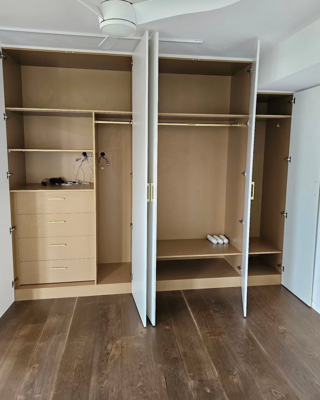Open White Wardrobe With Clothes Rails, Shelves, and Drawers — Canelo Cabinetry In Rocklea, QLD