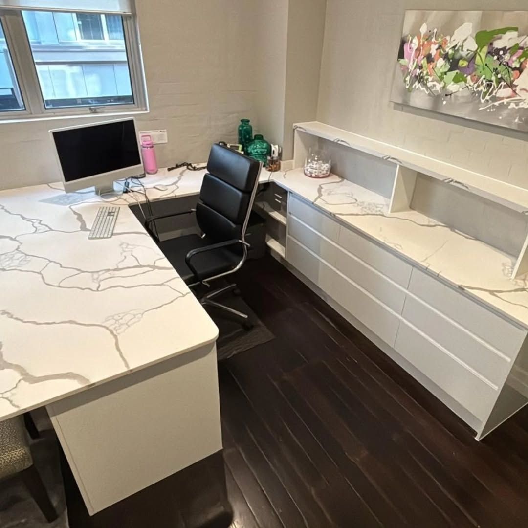 A Modern Office With a Marble-look Desk, Black Chair, and White Cabinets — Canelo Cabinetry In Rocklea, QLD