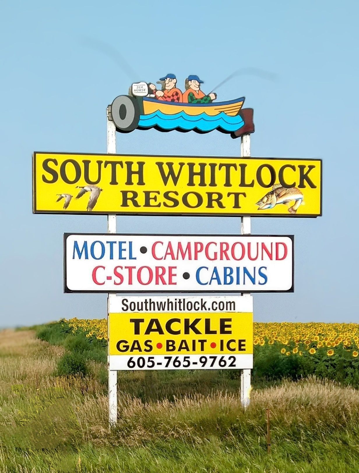 A sign for south whitlock resort motel campground c-store cabins tackle gas bait ice
