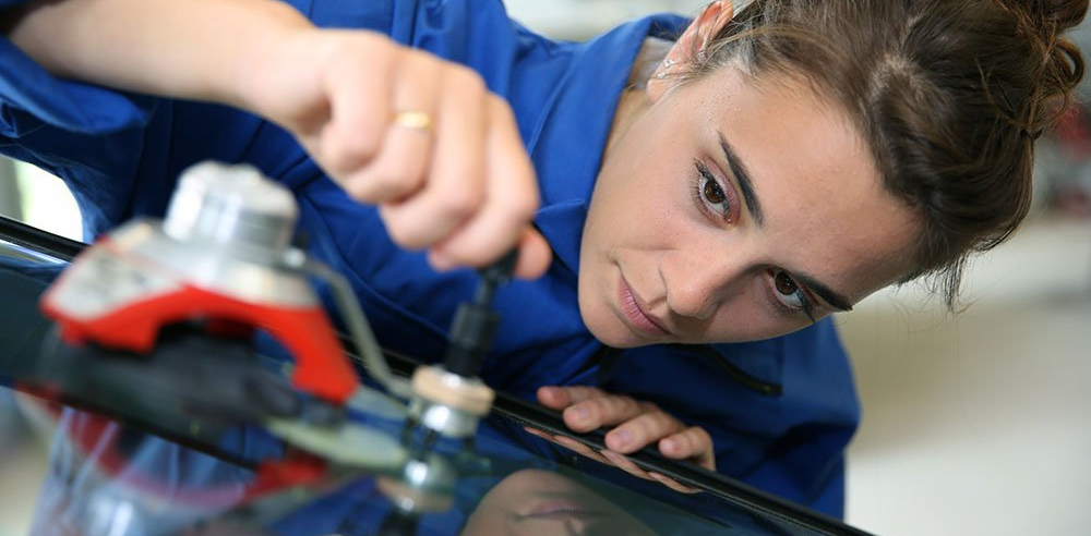 Woman Fixing Chipped Windshield