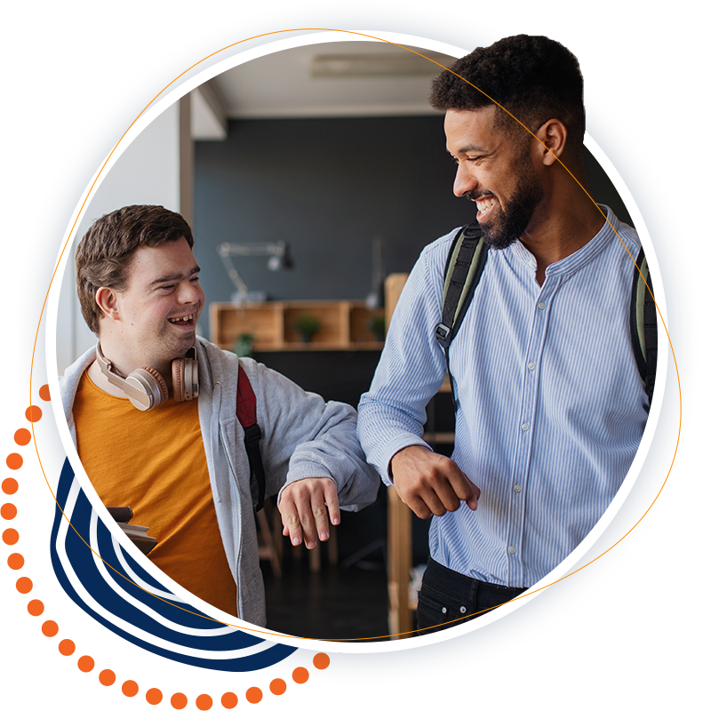 A man and a boy with down syndrome are giving each other a high five.