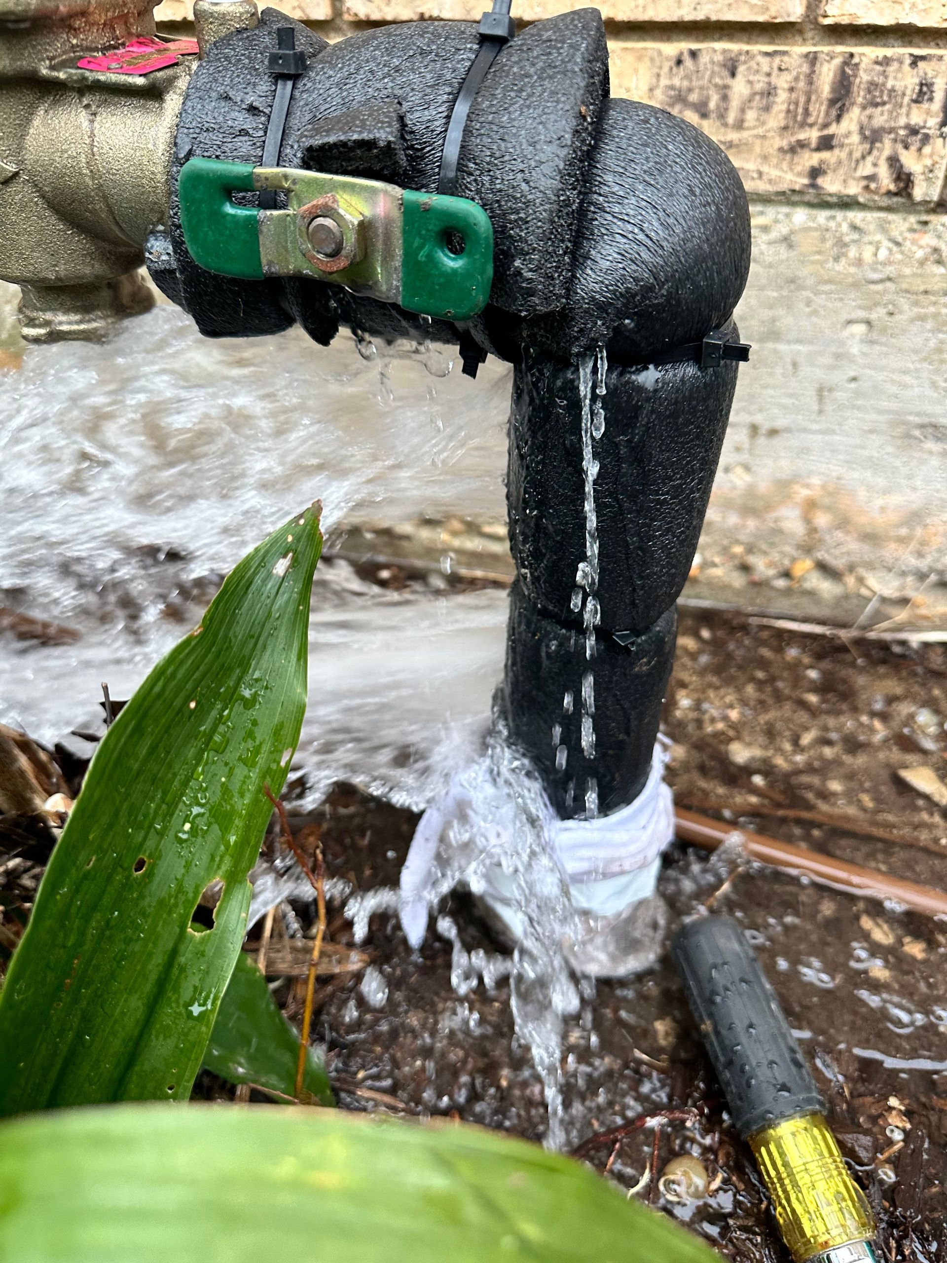 A close up of a faucet with water coming out of it.