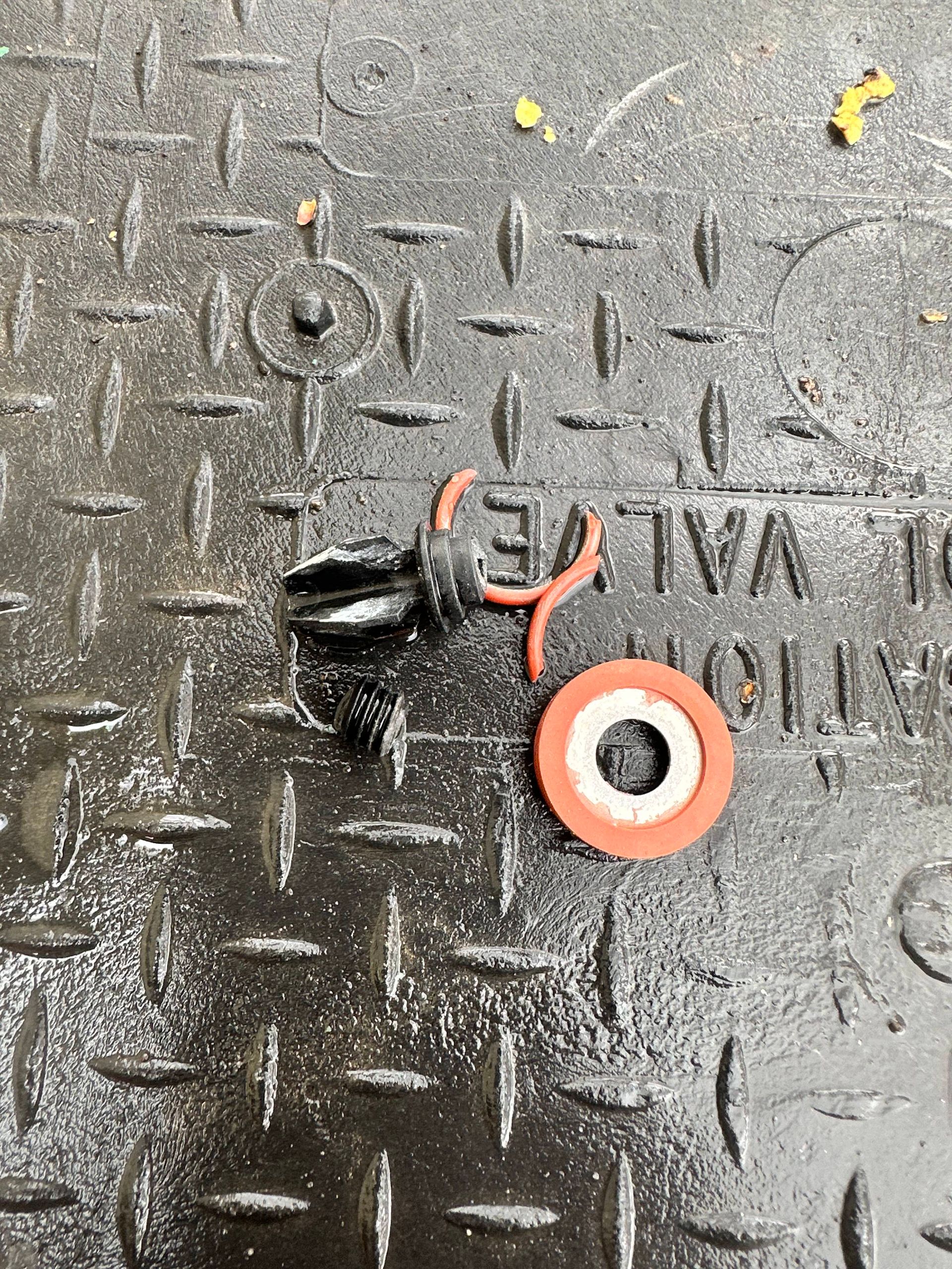 A close up of a valve on a metal surface