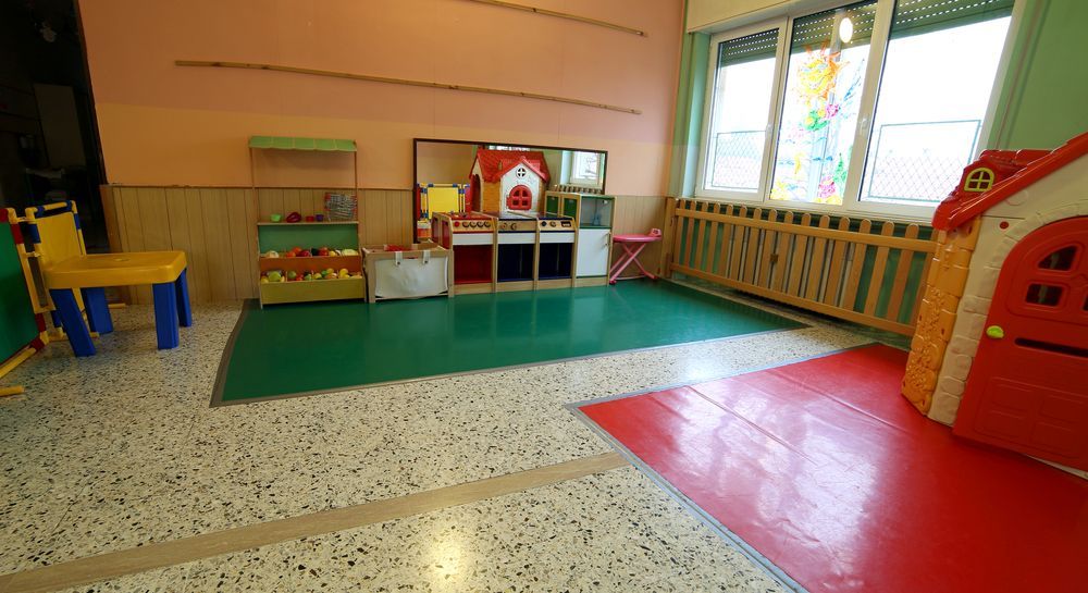 A Room With A Green Floor And A Red House In The Middle Of It — Wyong Commercial Cleaning In Morisset, NSW