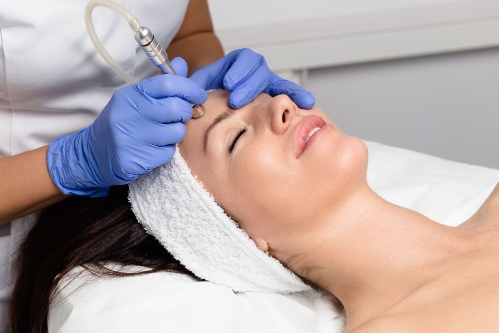 A Woman is Getting a Microneedling Treatment — Coastal Skin & Laser in Coolum, QLD
