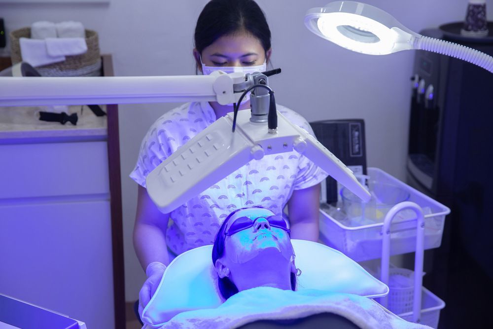 A Woman is Giving a Photodynamic Therapy — Coastal Skin & Laser in Coolum, QLD