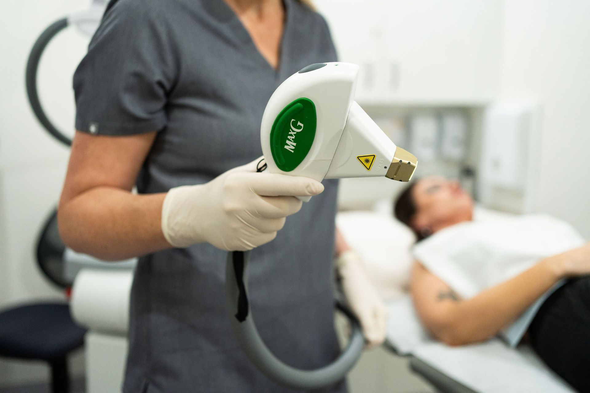 A Woman is Getting a Laser Treatment on Her Face — Coastal Skin & Laser in Tewantin, QLD