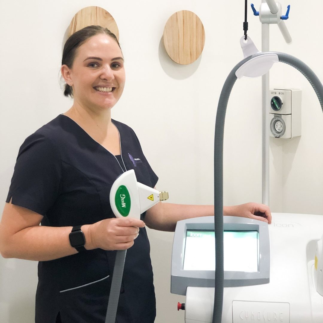 Professional Woman Standing Beside Laser Treatment Machine