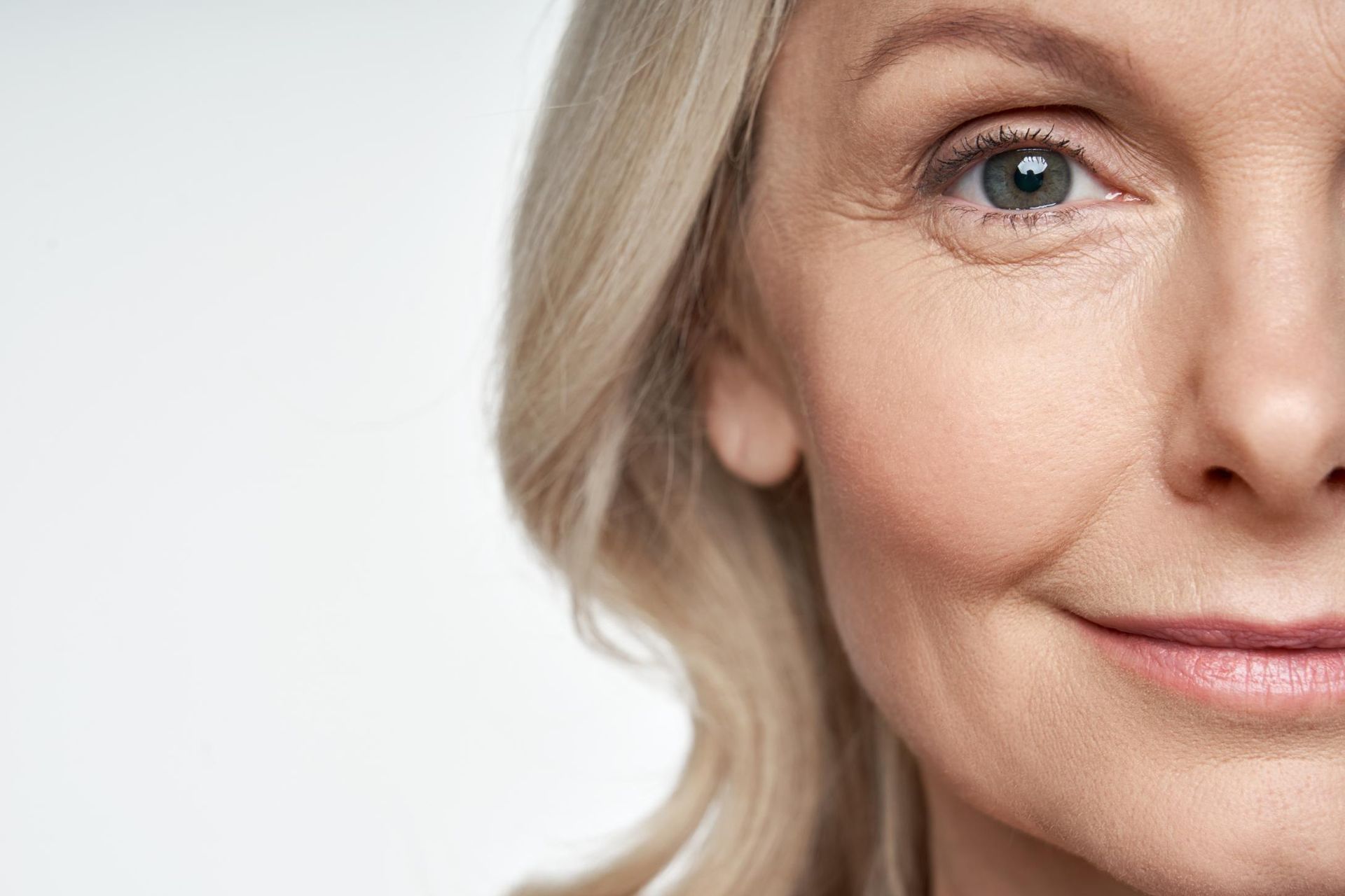 A Close Up of a Woman's Face With a Smile on Her Face — Coastal Skin & Laser in Mooloolaba, QLD