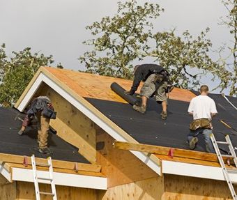 Team of professionals providing roofing services