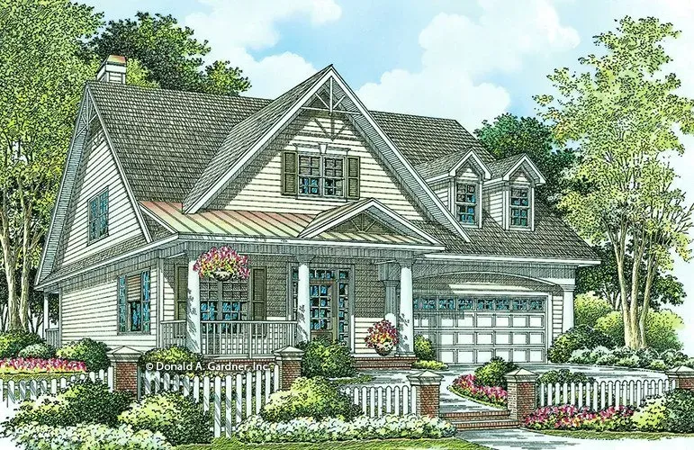 Cottage-style house with a porch, white picket fence, and landscaping. Gray roof, beige siding, and two-car garage.