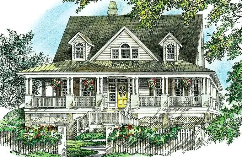 A quaint white house with a wrap-around porch and green roof, surrounded by trees and a picket fence.