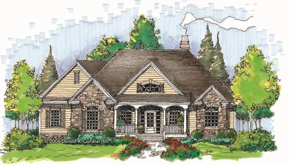 House with stone facade, front porch, and brown roof, set amidst trees and green grass.