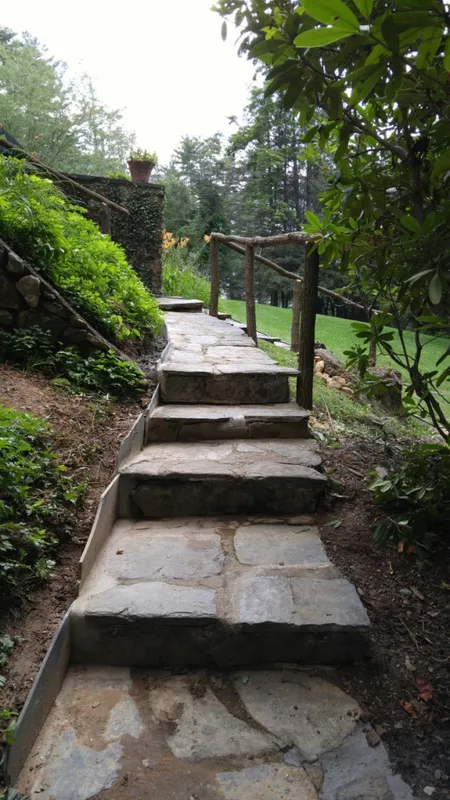 Stone steps lead upwards, flanked by greenery and a wooden railing.