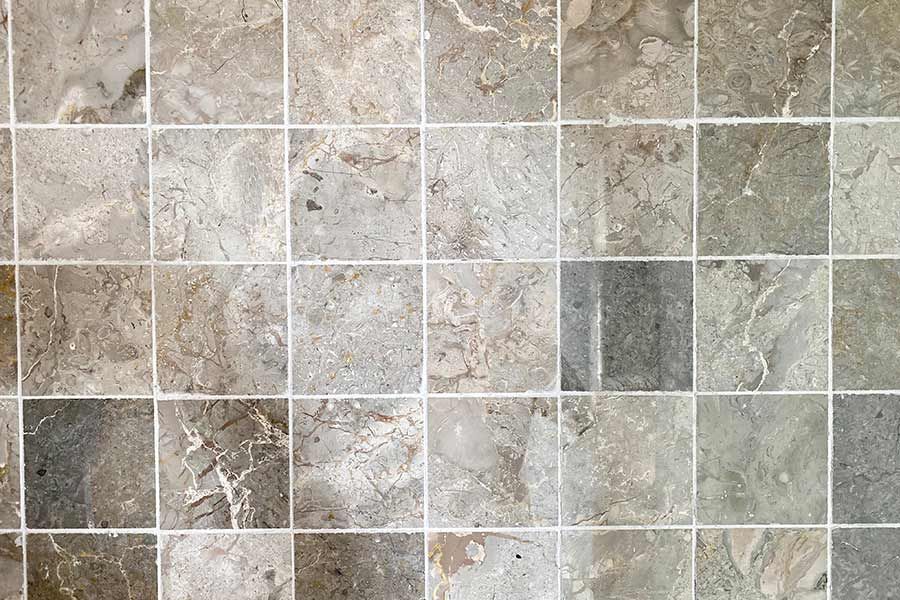 A Close up of a Tile Floor with a Marble Texture — Coffs Carpet Cleaning in Coffs Harbour, NSW