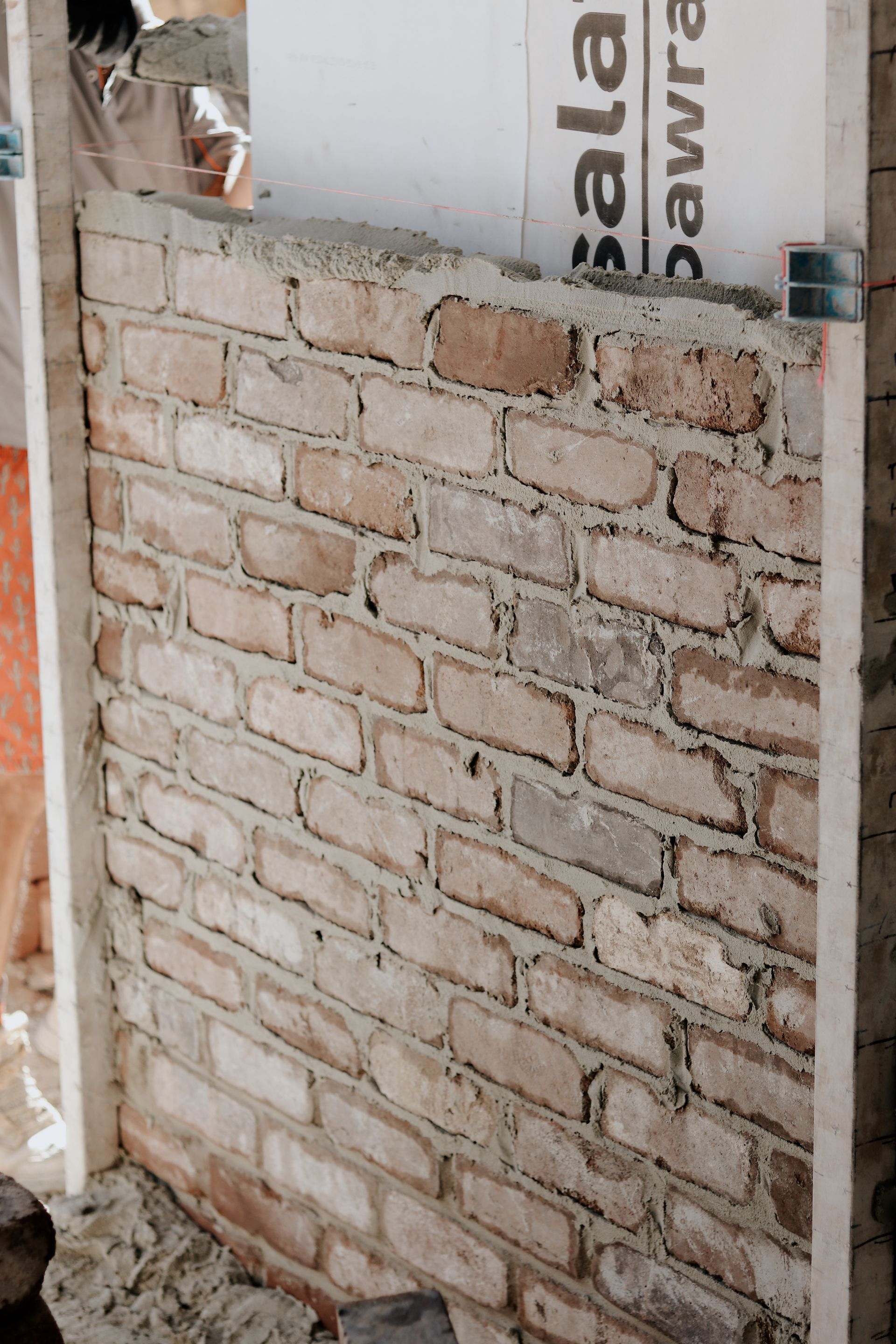 Brick Wall Being Constructed With Mortar — Ryan's Bricklaying In Port Stephens, NSW