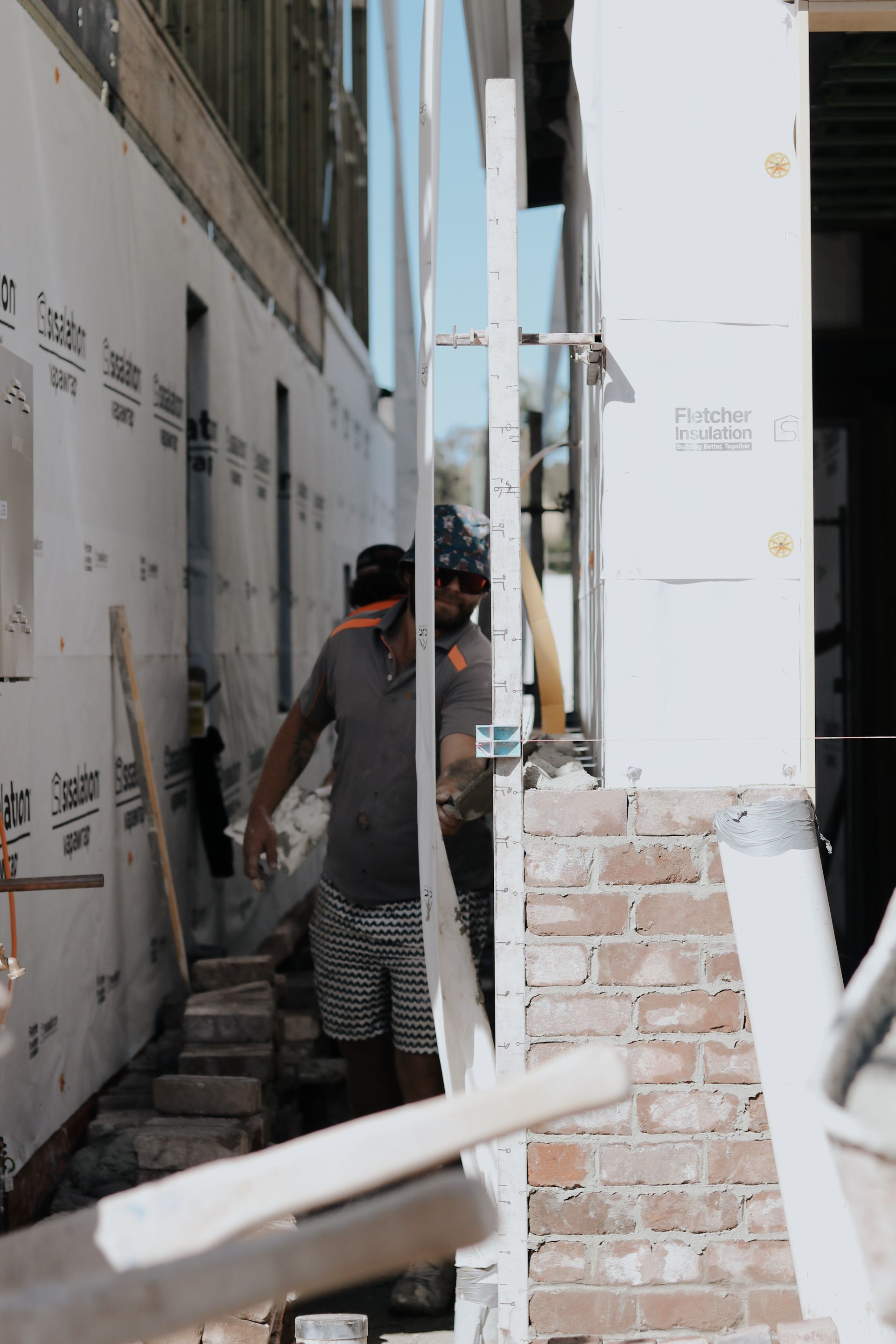 Construction Worker Standing Between Building Walls — Ryan's Bricklaying In Maitland, NSW