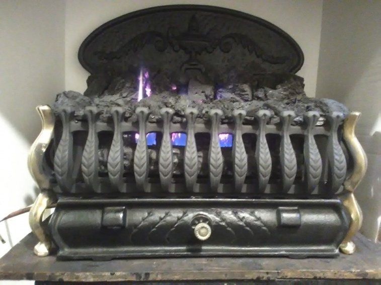 A fireplace with flames coming out of it