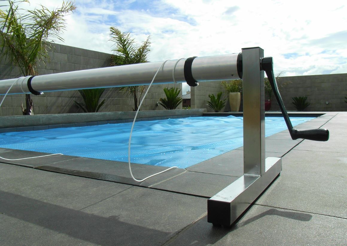 Swimming pool cover reels