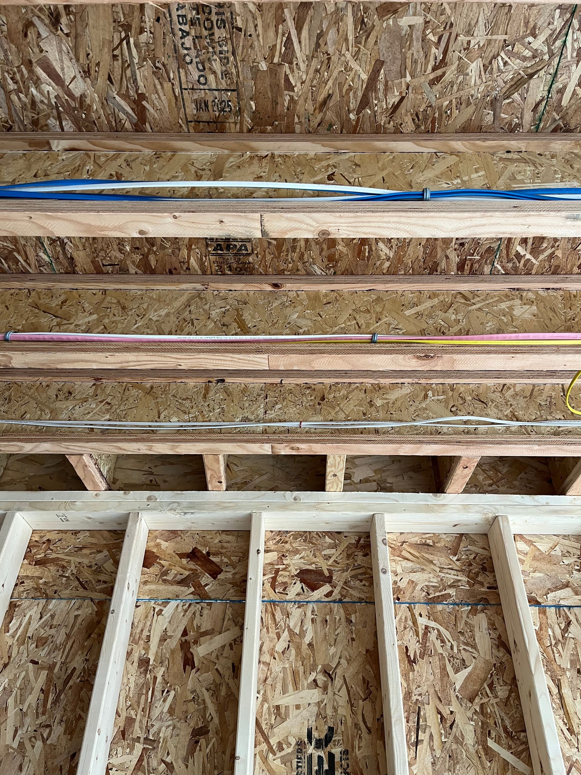A close up of the ceiling of a house under construction.