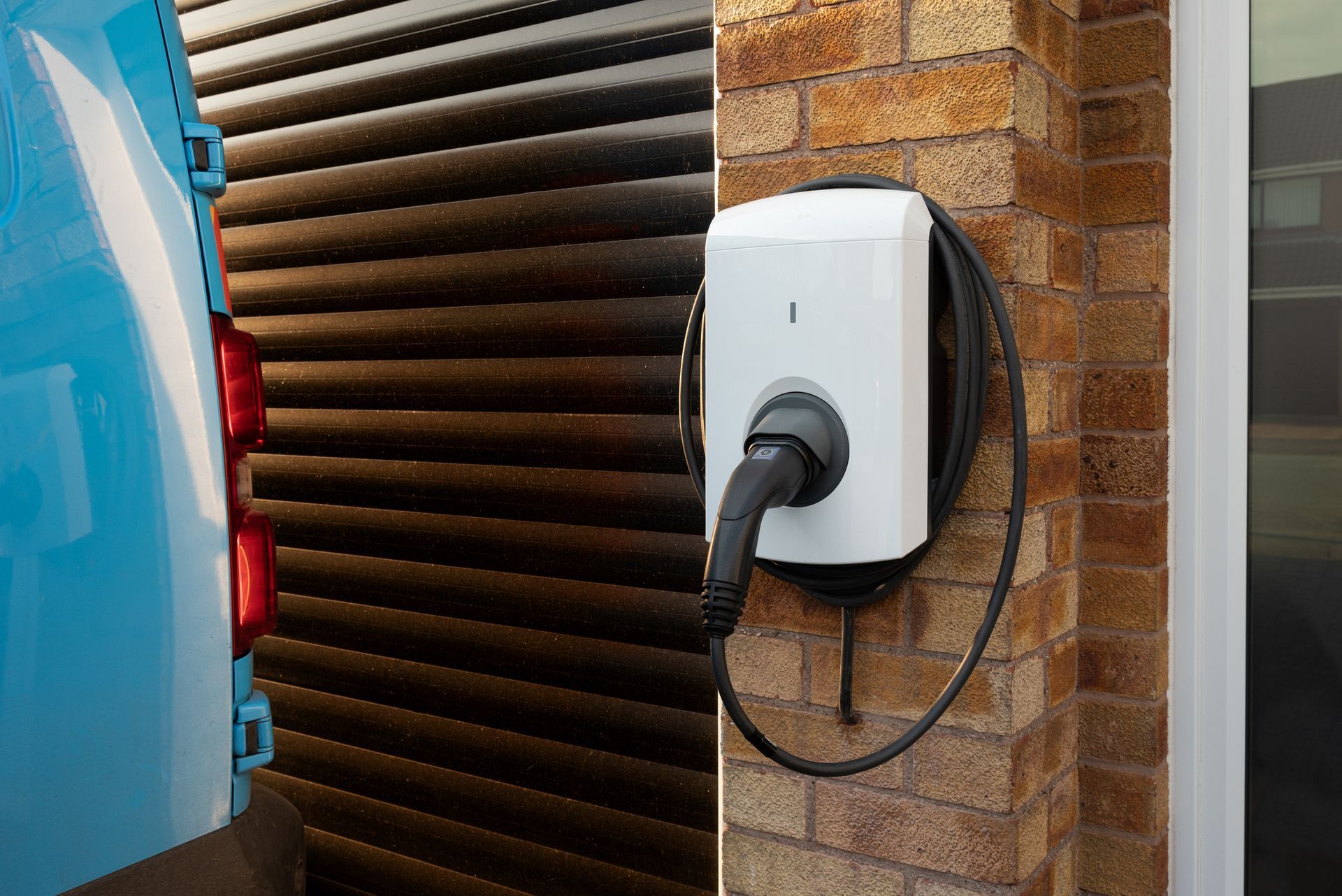 Electric vehicle charging at a residential home EV charger installation in Seattle Washington.
