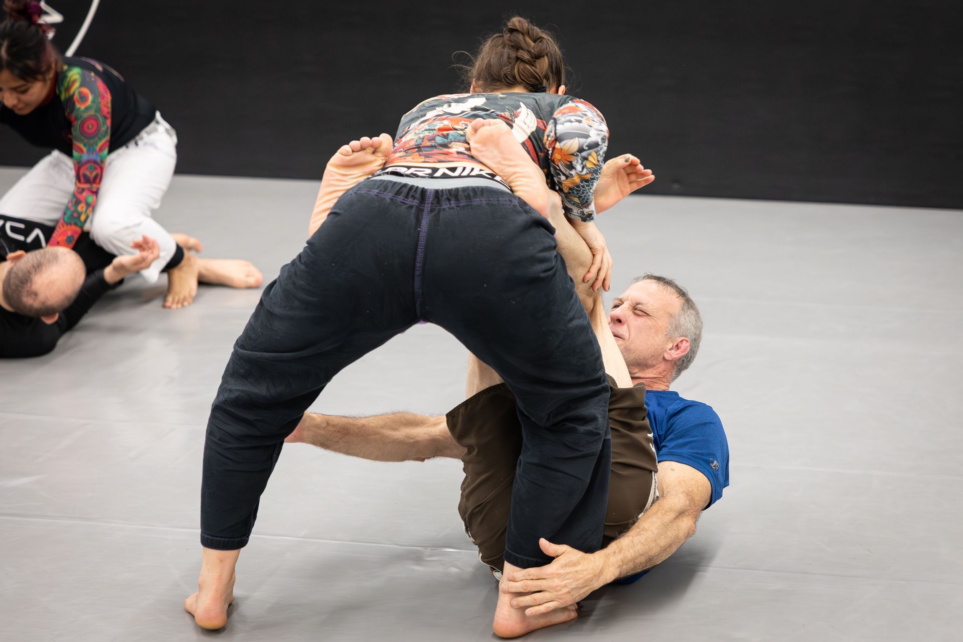 Adult Jiu-Jitsu partners drilling balance and guard movement at Soulcraft Martial Arts in Hamden, CT for coordination gains