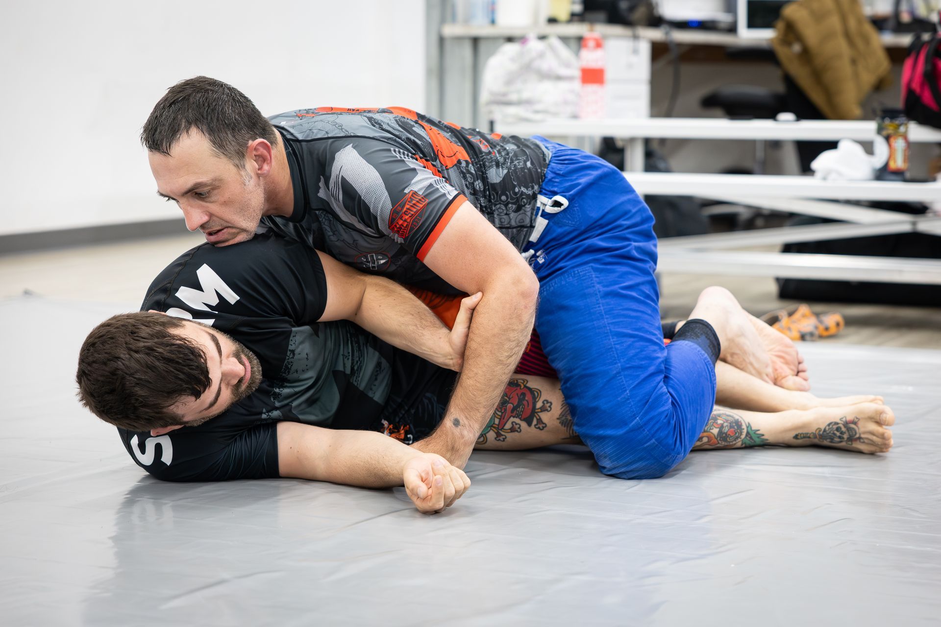 Adults drilling Brazilian Jiu Jitsu techniques at Soulcraft Martial Arts in Hamden, CT for fitness.