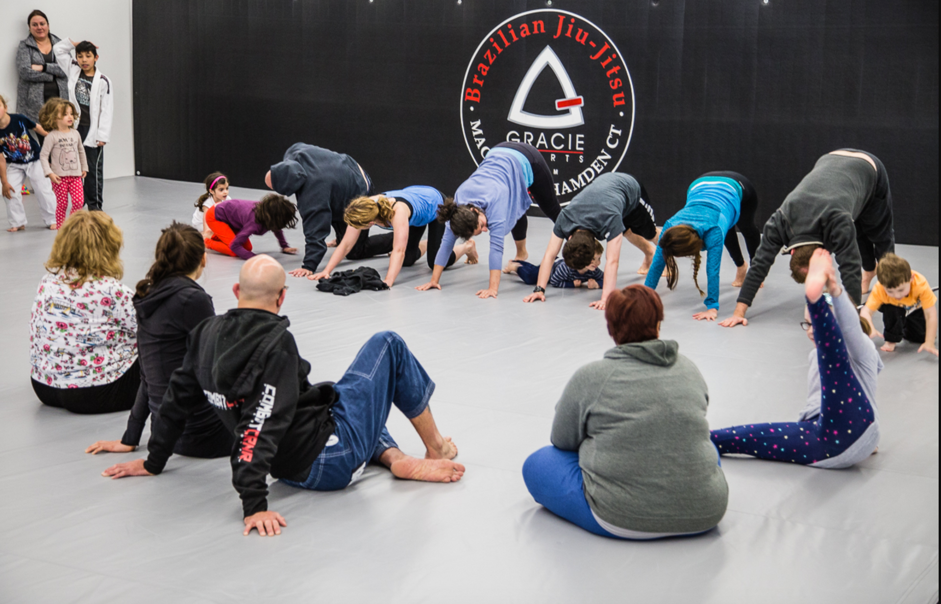 Family practicing Jiu-Jitsu drills at Soulcraft Martial Arts in Hamden, CT, building confidence.
