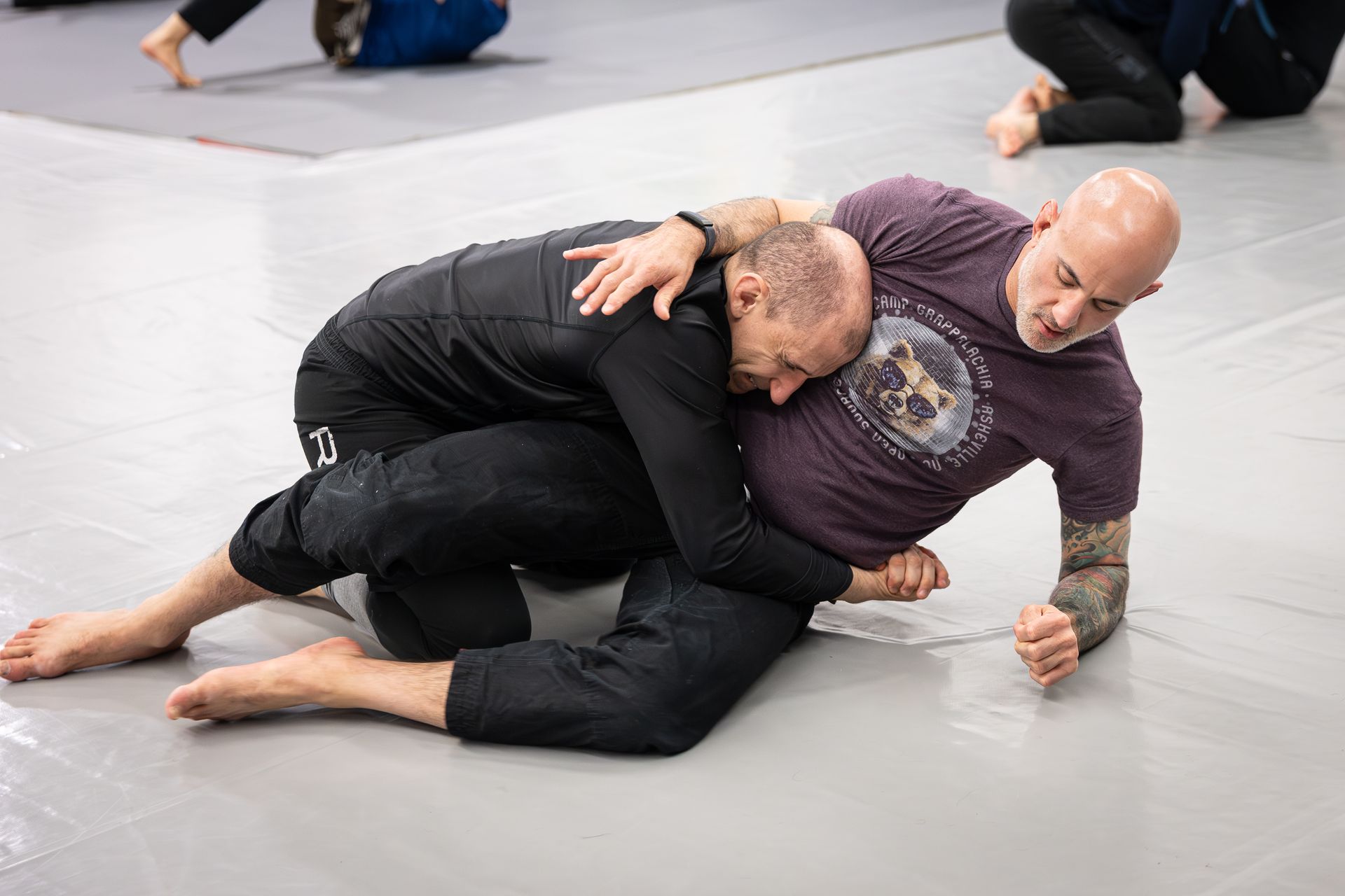 Adults drilling Brazilian Jiu-Jitsu technique at Soulcraft Martial Arts in Hamden, CT for fitness and confidence.