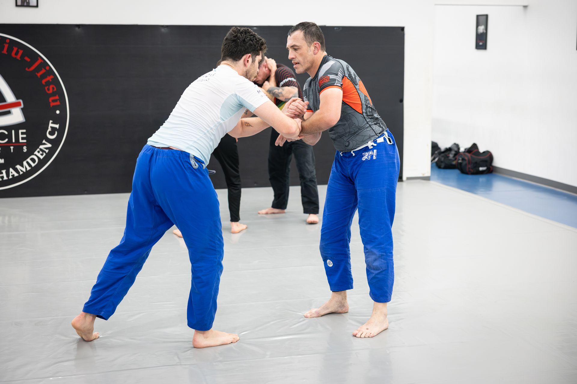 Adults drilling Brazilian Jiu-Jitsu techniques at Soulcraft Martial Arts in Hamden, CT to build fitness and confidence.