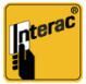 A yellow sign with a hand holding a card and the word interac on it.